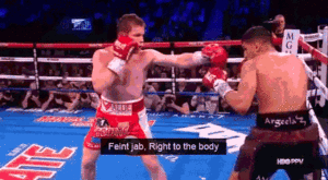 Boxer executing a feint jab, followed by a right to the body.