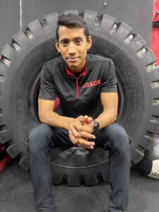 Coach Ravi donning his KOS gym coach attire.