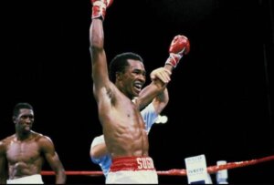 Sugar Ray Leonard triumphing in an exhilarating boxing match.